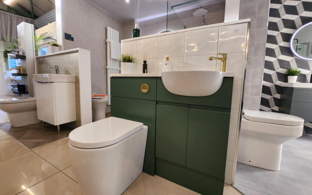 Elegant dark-green bathroom furniture displayed in a contemporary setting, showcasing a perfect blend of aesthetics and functionality.
